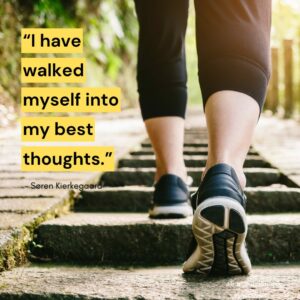 Woman walking up a trail with quote