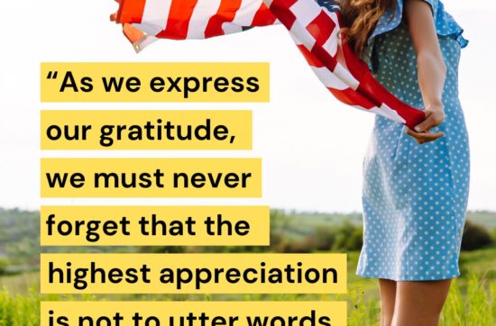 AHA Image with JFK quote about gratitude - woman holding usa flag in field