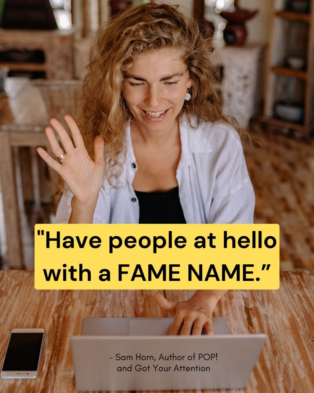 Woman at coffee shop logging into virtual meeting