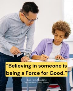 Teacher helping student