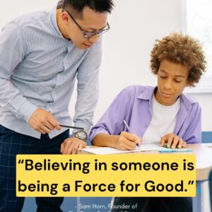 Teacher helping student